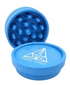 Treez Tools Eco Grinder, a high-quality, eco-friendly grinder made from sustainable, recycled materials, featuring sharp teeth for efficient grinding and a unique design to complement any collection of smoking accessories.