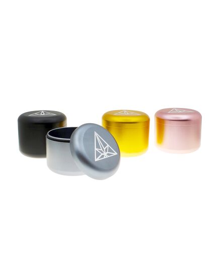 The Treez Club Herb Container Stash Jar, also known as CannaPuck 2.0, in black, showcasing its high-quality aluminum construction and compact, portable design